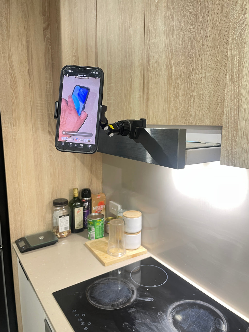 QENTROVA universal phone holder for car, motorcycle, bike, and desk, showing adjustable mount and secure grip on a smartphone.